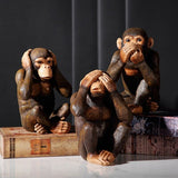 3 statues singes